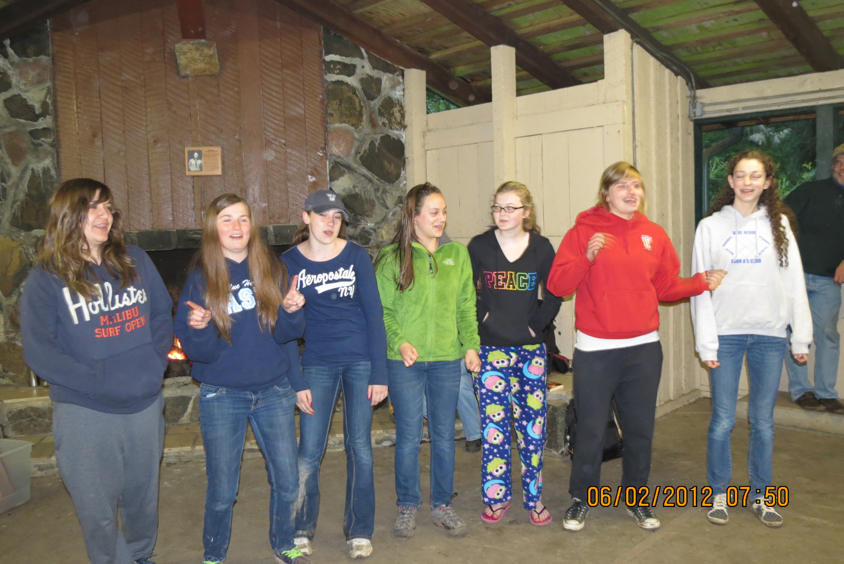 Seven 8th grade girls performing a song they made up.